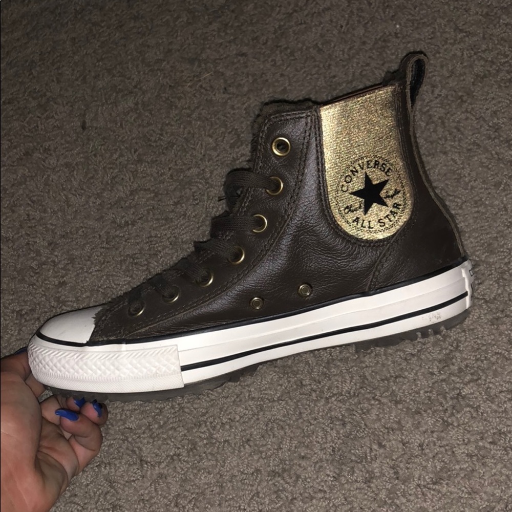 Brown leather converse